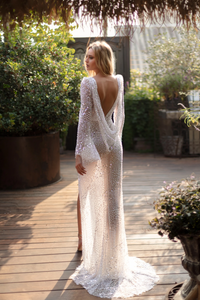 Unleash your adventurous spirit with the Florence Dress. Handmade with the finest fabrics and intricate detailing of crystals and pearls, this elegant and glamorous wedding dress will make you feel like a daring bride. Designed with timeless patterns, off-the-shoulder corset bodices, and flowing skirts, it's the perfect choice for a sophisticated and bold look.