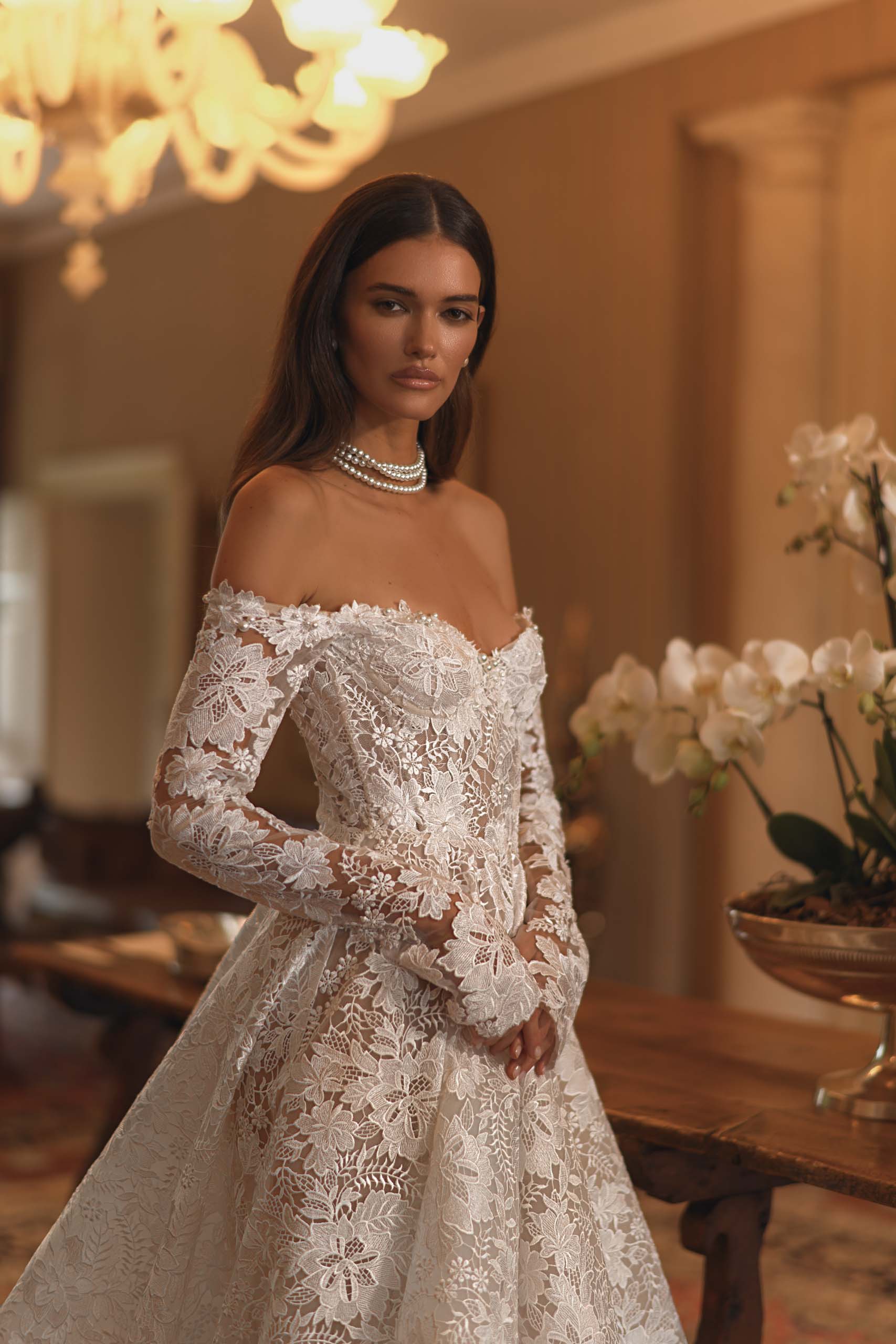 Discover the enchanting elegance of our Amira Gown, inspired by modern fairytales. Crafted with luxurious lace, this ballgown highlights your beauty and brings a touch of timeless grace to any special occasion. Make a statement with this stunning gown.