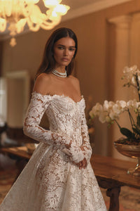 Discover the enchanting elegance of our Amira Gown, inspired by modern fairytales. Crafted with luxurious lace, this ballgown highlights your beauty and brings a touch of timeless grace to any special occasion. Make a statement with this stunning gown.
