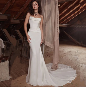 Elegant, sophisticated, and undeniably alluring, the Robe Sarita is the perfect wedding dress for the modern bride. With its strapless design, delicate lace appliques, and flattering mermaid silhouette, it exudes a sense of romance and grace. Whether you're walking down the aisle or dancing the night away, this gown will make you feel like the most beautiful bride.