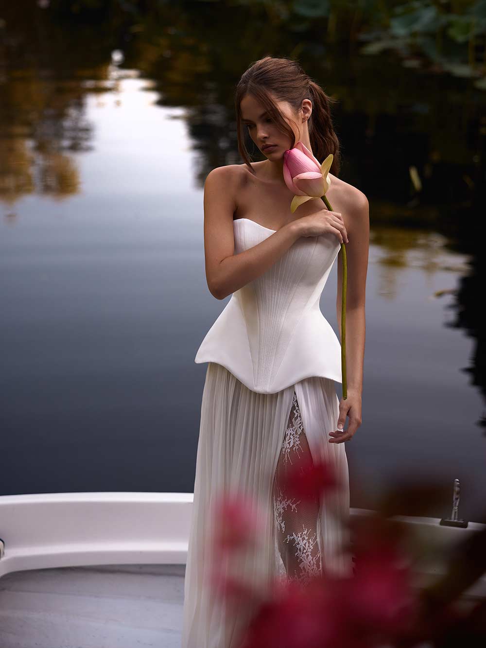 Indulge in the luxurious elegance of the Fiorella Dress. With a stunning satin sweet-heart design, this dress perfectly contours your figure, while structured boning offers support and a refined lace-up back creates a sharp, defined silhouette. It's the perfect piece for radiating timeless sophistication.