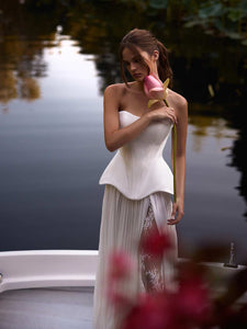 Indulge in the luxurious elegance of the Fiorella Dress. With a stunning satin sweet-heart design, this dress perfectly contours your figure, while structured boning offers support and a refined lace-up back creates a sharp, defined silhouette. It's the perfect piece for radiating timeless sophistication.