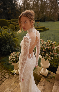 Looking for a stunning wedding dress? Look no further than our Aidy Gown! This beautifully crafted gown features delicate lace and a figure-flattering mermaid silhouette. With long sleeves and a bespoke fit, you'll feel confident and radiant on your special day. Say "I do" in style with this gorgeous dress.