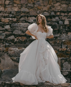 The Danielle Dress is everything you could dream of in a fantasy bridal gown. Enchanting, chic, and romantic, it will make you feel like a princess on your special day. The flowy design adds a touch of elegance, making it the perfect choice for a fairytale wedding. Say "I do" to the dress of your dreams.