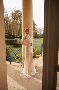 Looking for a stunning wedding dress? Look no further than our Aidy Gown! This beautifully crafted gown features delicate lace and a figure-flattering mermaid silhouette. With long sleeves and a bespoke fit, you'll feel confident and radiant on your special day. Say "I do" in style with this gorgeous dress.