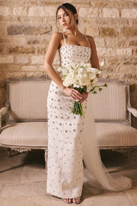 Robe Martine is hand embellished with details that will have you looking your most glamorous on your special day.&nbsp;The attention to detail is exquisite, as 'Martine' is beautifully embellished with faux pearls and silver crystals throughout. It's underpinned with our incredible corsetry boning to create a secure, structured fit to cinch your waist and it's finished by slender straps.