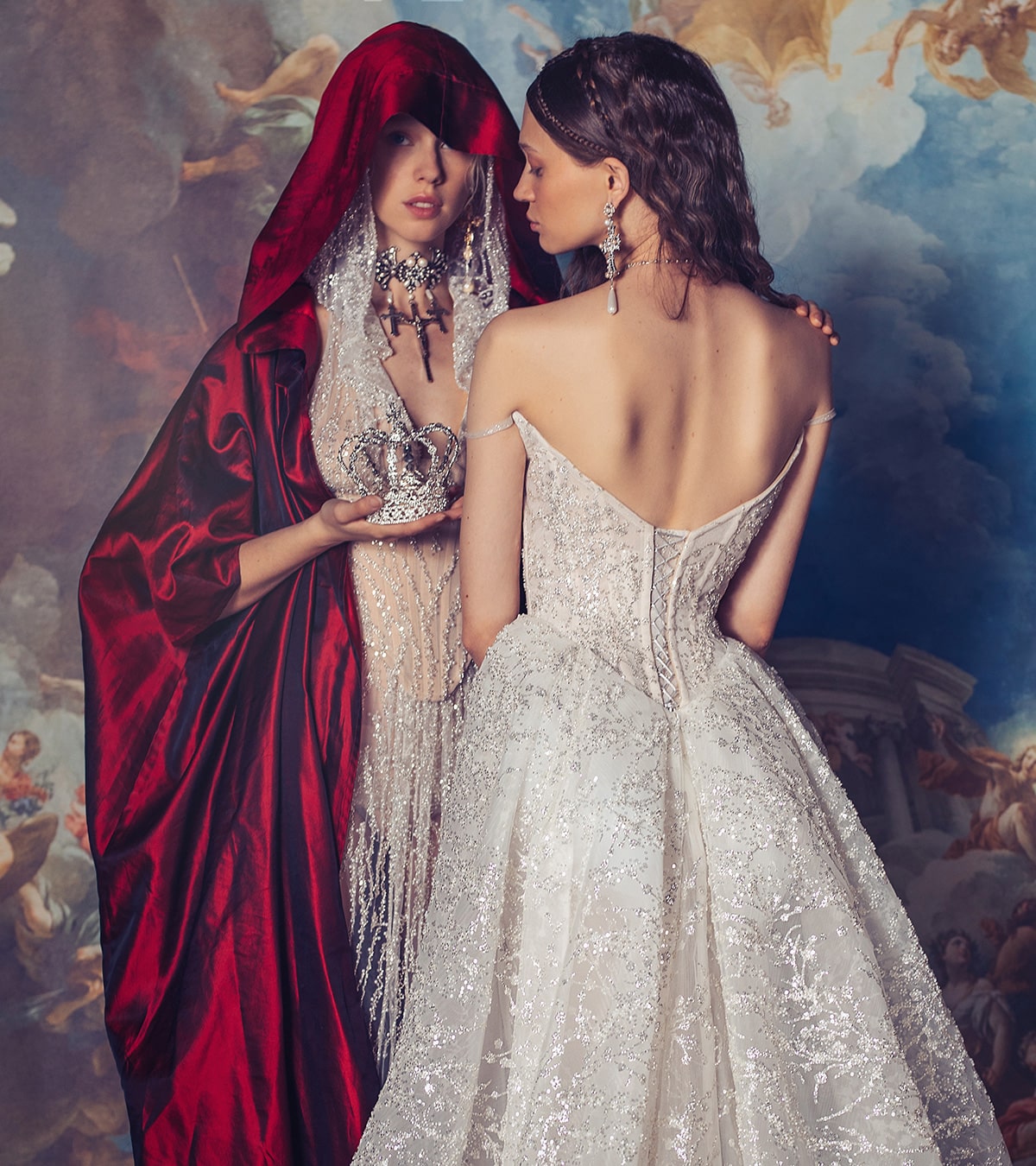 Indulge in luxury with the Elizabeth Gown. Exquisite and hand-crafted, this dress features a corseted bodysuit adorned with intricate appliqué and delicate lace overlay. The voluminous silk taffeta skirt adds a touch of drama, making it the perfect choice for your special occasions. Elevate your style and make a statement with this exclusive and elegant gown.