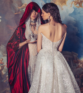 Indulge in luxury with the Elizabeth Gown. Exquisite and hand-crafted, this dress features a corseted bodysuit adorned with intricate appliqué and delicate lace overlay. The voluminous silk taffeta skirt adds a touch of drama, making it the perfect choice for your special occasions. Elevate your style and make a statement with this exclusive and elegant gown.