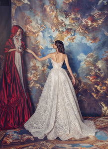 Indulge in luxury with the Elizabeth Gown. Exquisite and hand-crafted, this dress features a corseted bodysuit adorned with intricate appliqué and delicate lace overlay. The voluminous silk taffeta skirt adds a touch of drama, making it the perfect choice for your special occasions. Elevate your style and make a statement with this exclusive and elegant gown.