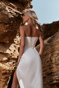 Elevate your special occasion with the Olympia Satin Dress. Made from luxurious satin, this dress features a high slit design for a touch of glamour. Whether for your wedding, prom, or any formal event, this open leg mermaid silhouette dress will surely make you stand out.