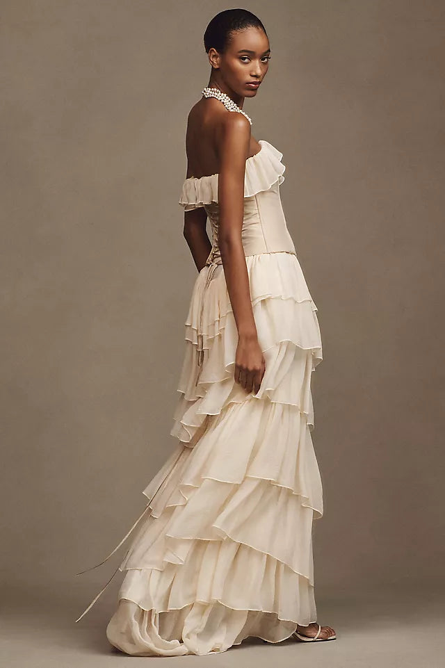 Take center stage and make a bold statement in the Ballet Gown. Made of luxurious silk chiffon, this gown features cascading ruffle tiers, bust ruffle, and silicone elastic trim for a secure fit. The invisible zipper and internal shelf bra add convenience, while the lightweight mesh bodice adds breathability. Unleash your inner risk-taker and shine in the Ballet Gown!