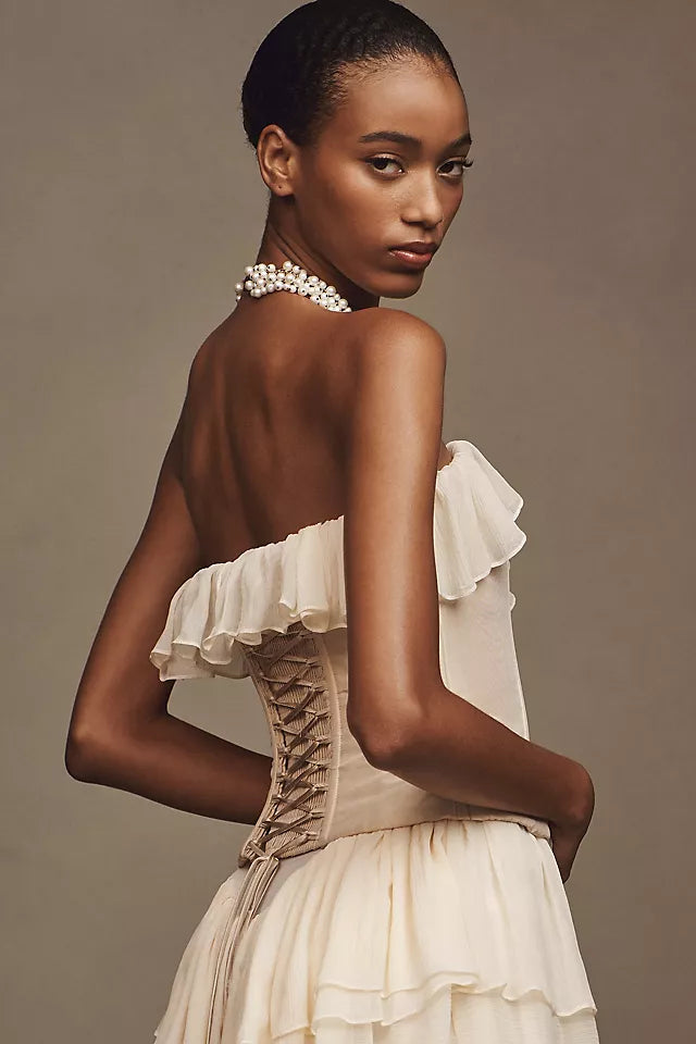 Take center stage and make a bold statement in the Ballet Gown. Made of luxurious silk chiffon, this gown features cascading ruffle tiers, bust ruffle, and silicone elastic trim for a secure fit. The invisible zipper and internal shelf bra add convenience, while the lightweight mesh bodice adds breathability. Unleash your inner risk-taker and shine in the Ballet Gown!