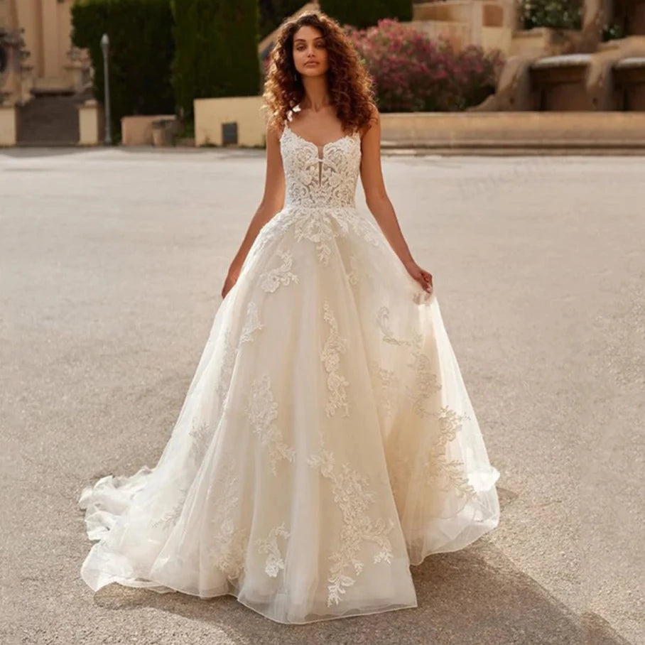 Style your dream day with this stunningly beautiful Robe Ornellia. Featuring a romantic sweetheart neckline, the A-line silhouette is designed to flatter any figure, while crystal beadwork and applique detail add the perfect touch of drama. With a romantic criss-cross back and elegant train, you'll be a show-stopping bride in this gorgeous wedding dress!