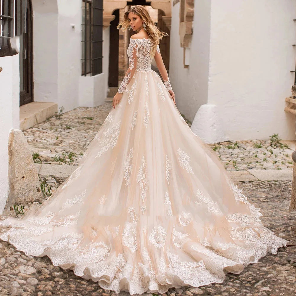 This exquisite Robe Justine mermaid wedding dress is a timeless classic; exclusive boat neckline and vintage-inspired button back with detachable train create a stunning look perfect for a special day. Lace appliques and long sleeves add an elegant and breathtaking finish, making this bridal gown truly unforgettable.