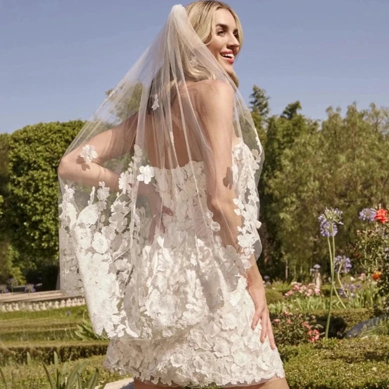 This strapless wedding dress is the epitome of elegance and sophistication. The delicate applique adds a touch of femininity, while the A-line design is both flattering and comfortable. With a high-quality construction and mini length, the Civil Robe Delancey is perfect for any bride's special day. Say "I do" to this beautiful dress.