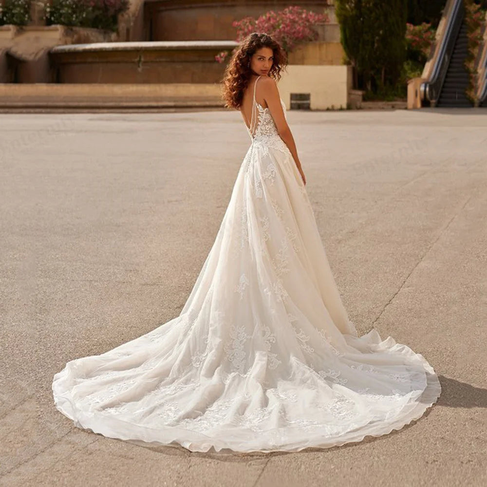 Style your dream day with this stunningly beautiful Robe Ornellia. Featuring a romantic sweetheart neckline, the A-line silhouette is designed to flatter any figure, while crystal beadwork and applique detail add the perfect touch of drama. With a romantic criss-cross back and elegant train, you'll be a show-stopping bride in this gorgeous wedding dress!
