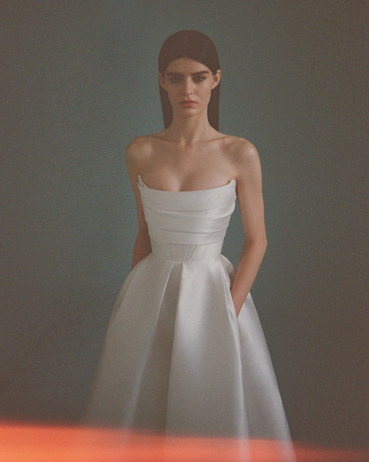 'Isobel' gown is such an elegant choice for your special day. Crafted from white satin-faille with a lustrous finish, it has the signature sculptural bodice and a full skirt with pleats that add structure and volume.