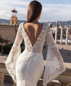 Be the boho bride of your dreams in our Robe Sherryl wedding dress! With a flirty v-neck, elegant flare sleeves, and stunning lace appliques, this mermaid gown will turn heads. Custom made and featuring a backless design and sweeping train, it's the perfect combination of comfort and wow factor. Live out your fairytale in style. (All hail the boho queen!)