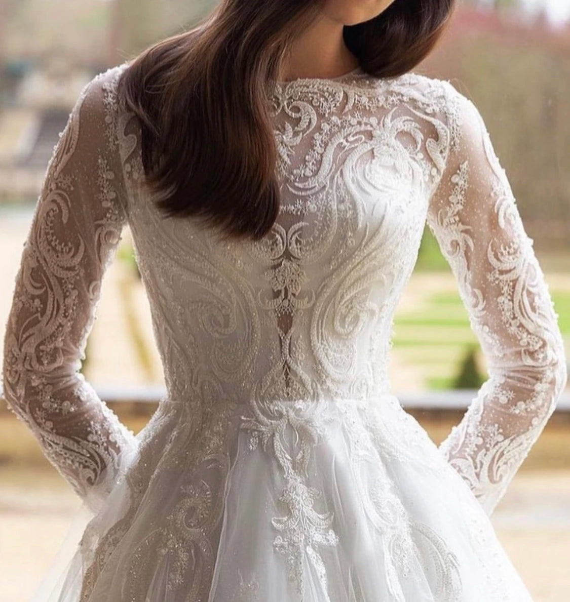 Unleash your fearless spirit with the Robe Lynette. This vintage lace wedding dress boasts a dramatic A-line silhouette, full sleeves, and delicate lace appliques adorned with sparkling sequins and beads. With a daring O-neckline and sweeping train, this dress is perfect for the adventurous bride ready to take on anything!