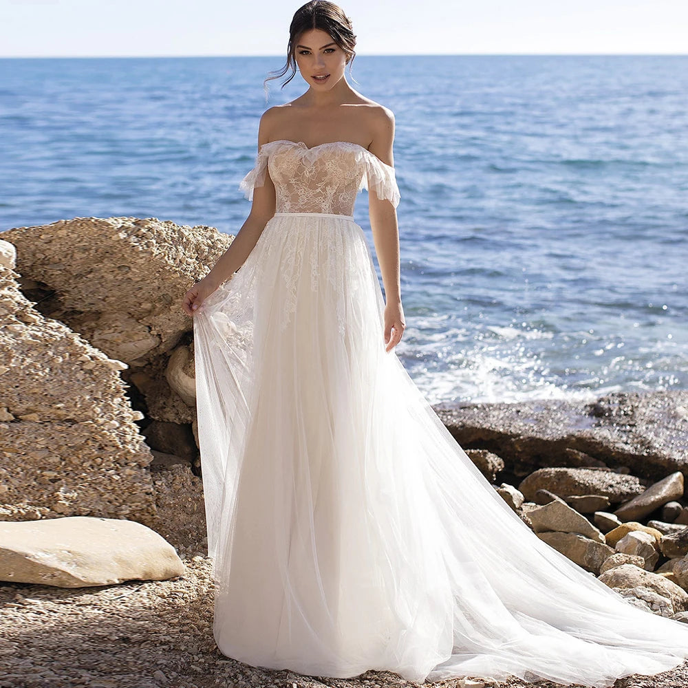 The Robe Juliet adds a touch of elegance to any bridal gown with its backless design and flowing tulle court train. The sashes add a unique detail to complete the look. Made with high-quality materials, this gown is perfect for any wedding.