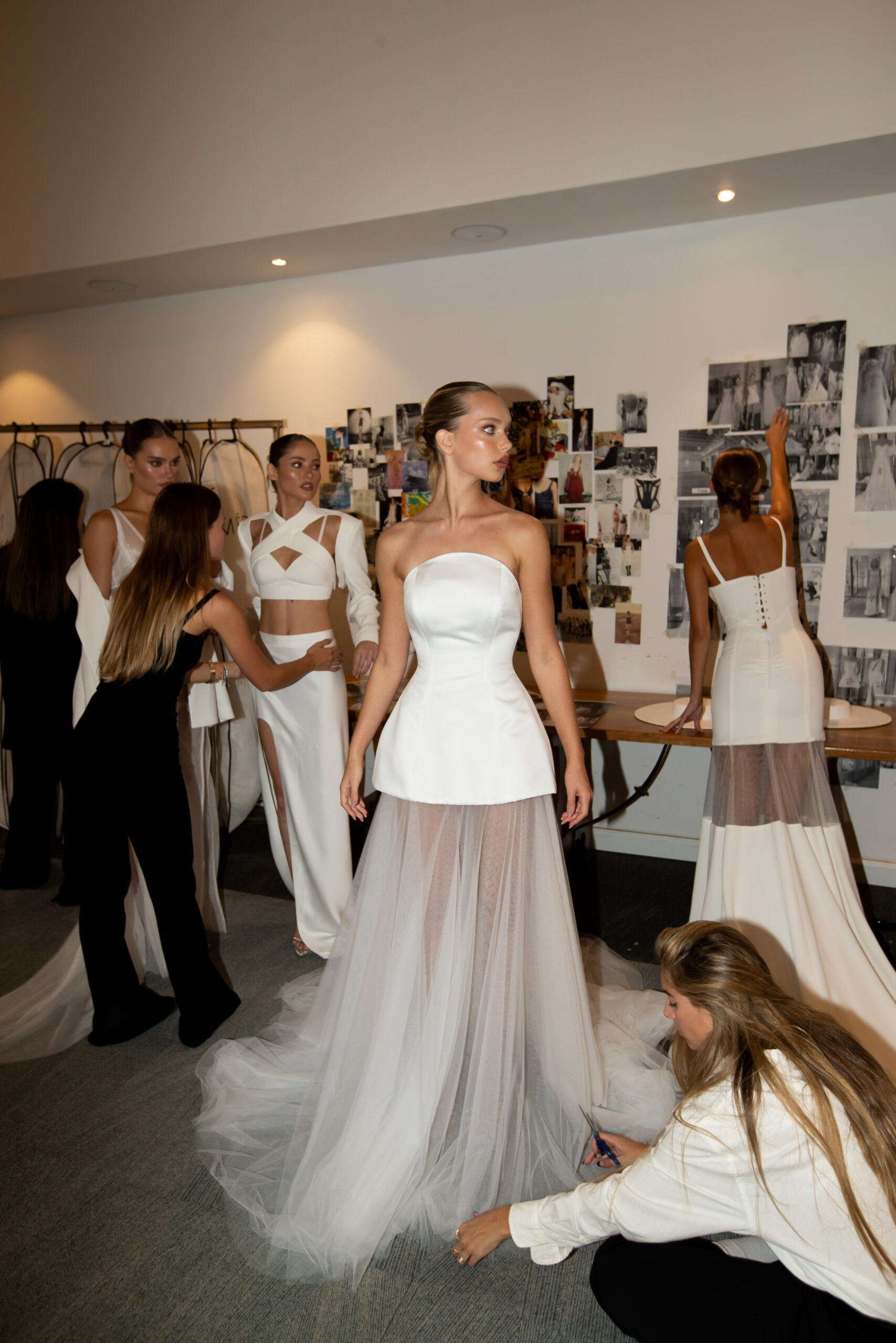Introducing the Fabienne Gown, the perfect choice for the modern bride. This simple yet stylish gown features a corset bodice and transparent skirt, making it fashion-forward and chic. Be the center of attention on your special day with this unique wedding dress.