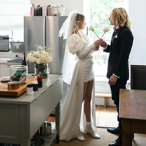 Indulge in elegance with Dress Mia: a stunning wedding dress with a sweet square neck, long fluffy sleeves, and custom-made ruching. The A-line silhouette and shirred straps create a flattering shape, while the luxurious satin fabric adds a touch of sophistication. Make your special day even more memorable with this exclusive dress.