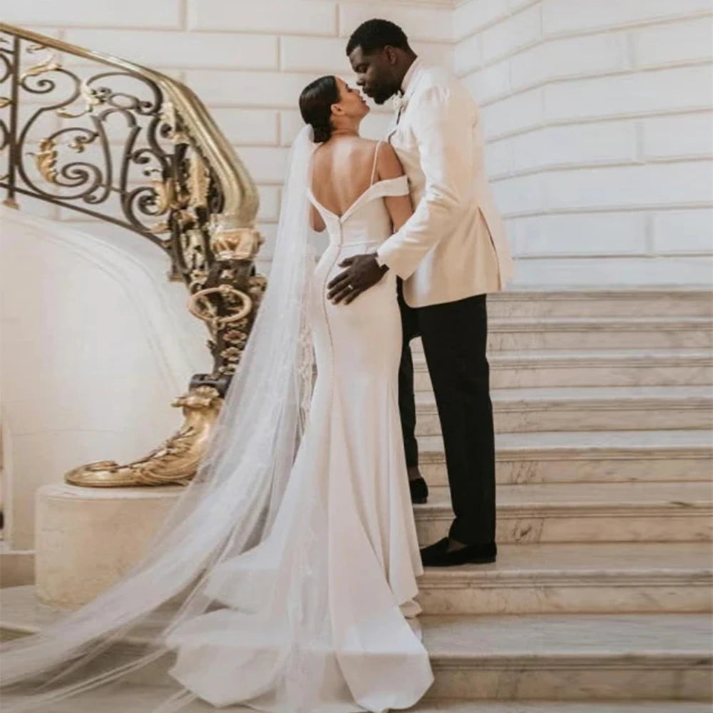 Capture hearts in the beautiful Satin Dress Emma. Custom made with exquisite details, this classic outdoor wedding dress is perfect for a stunning and elegant look on your special day. Enjoy the open design as you confidently walk down the aisle. Make a statement that will be remembered forever.