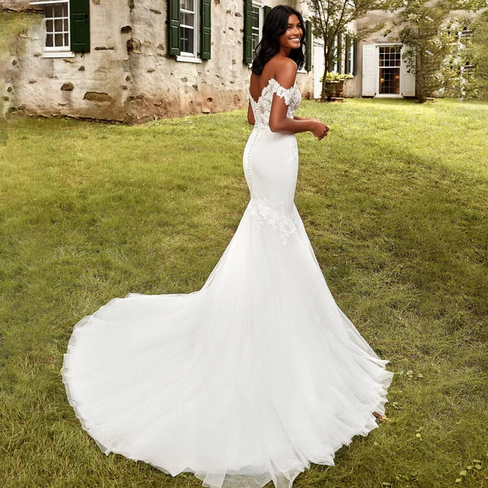Experience the timeless elegance of Robe Fate, the perfect choice for your special day. These mermaid wedding dresses feature delicate boho lace appliques and a stunning backless design that will take your breath away. Feel like a true bride with these intricately crafted bridal gowns.