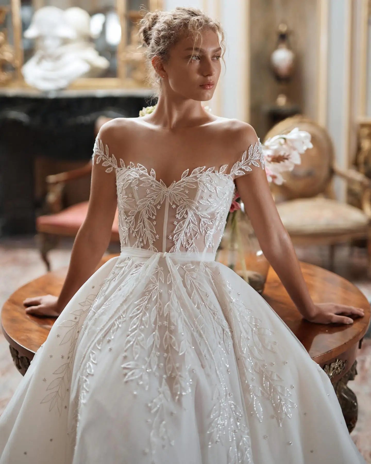 Indulge in luxury on your special day with our Dress Denisse. This stunning ball gown dress features delicate lace, long elegant sleeves, and a flattering silhouette. Perfect for a grand entrance and unforgettable memories. Elevate your wedding attire and make your dreams come true with Dress Denisse.