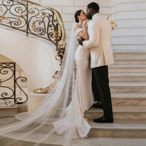 Capture hearts in the beautiful Satin Dress Emma. Custom made with exquisite details, this classic outdoor wedding dress is perfect for a stunning and elegant look on your special day. Enjoy the open design as you confidently walk down the aisle. Make a statement that will be remembered forever.
