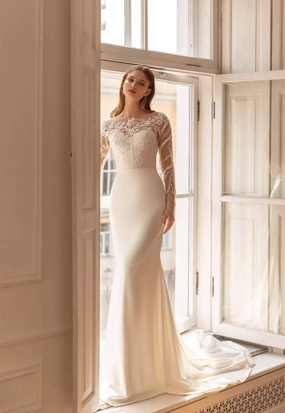 Upgrade your wardrobe with our elegant Robe Ashley. This stunning gown features intricate embroidered lace, creating a flattering mermaid silhouette. The chic long sleeves add a touch of sophistication to this must-have piece. Elevate your style and make a statement with Robe Ashley.