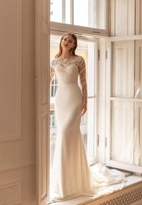 Upgrade your wardrobe with our elegant Robe Ashley. This stunning gown features intricate embroidered lace, creating a flattering mermaid silhouette. The chic long sleeves add a touch of sophistication to this must-have piece. Elevate your style and make a statement with Robe Ashley.