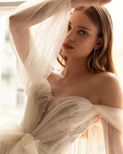 This stunning Robe Annalisa is the perfect choice for any bride-to-be. With a sweetheart neckline, full sleeve design, and beautiful bow detail, it combines elegance and femininity. The A-line silhouette flatters any body type, making you feel confident and gorgeous on your special day. Complete your look with this must-have wedding dress.