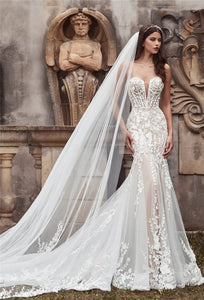 Adorn yourself in luxury with the Robe Olivette, a stunning lace wedding dress fit for a mermaid princess. This dress boasts intricate lace detailing and a form-fitting silhouette to enhance your natural beauty on your special day. Elevate your wedding look with the sophisticated elegance of the Robe Olivette.