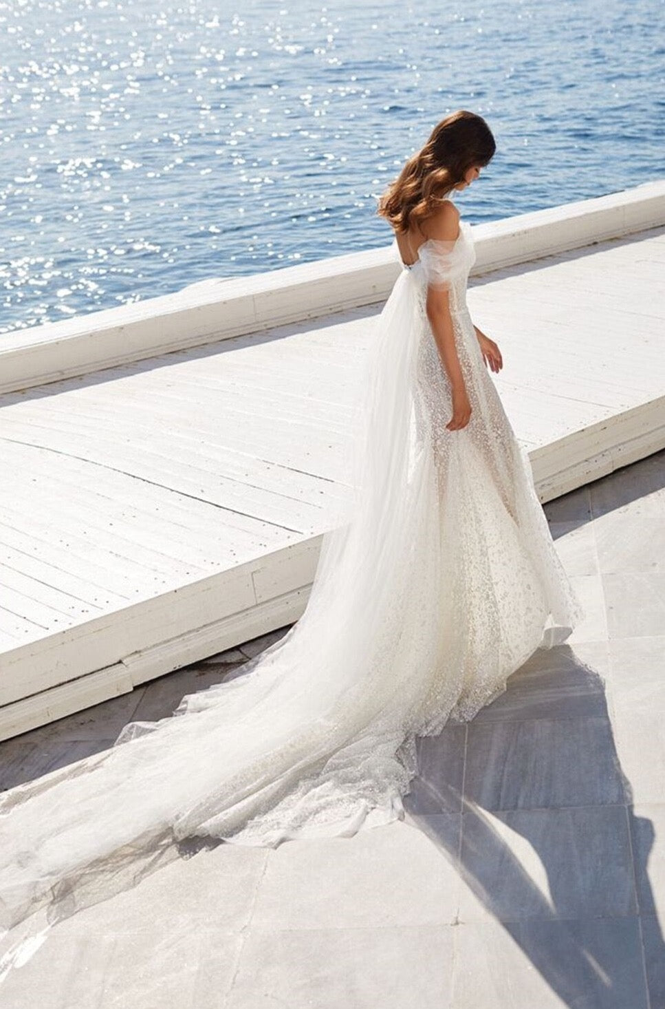 Look like a queen in our stunning Jessie Robe! Illuminating the room with its mermaid lace and off-the-shoulder silhouette, this bridal gown will make you feel like you're ready to rule the night. So, don your crown and get ready for the royal treatment you deserve!