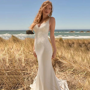 Get ready to turn heads on your special day with the Robe Georgette! Designed with a sultry V-neck and stunning lace appliques, this mermaid style wedding dress will bring out your inner beach goddess. Say "I do" in style and comfort with its sleeveless design.