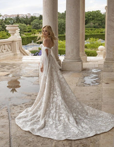 Make your wedding day extra special in our one-of-a-kind Robe Beau! This off-the-shoulder lace beauty will have you feeling like a princess, with its appliqué details, fit for a queen! Lace up your wedding day look with the Robe Beau and make it a moment you'll never forget!
