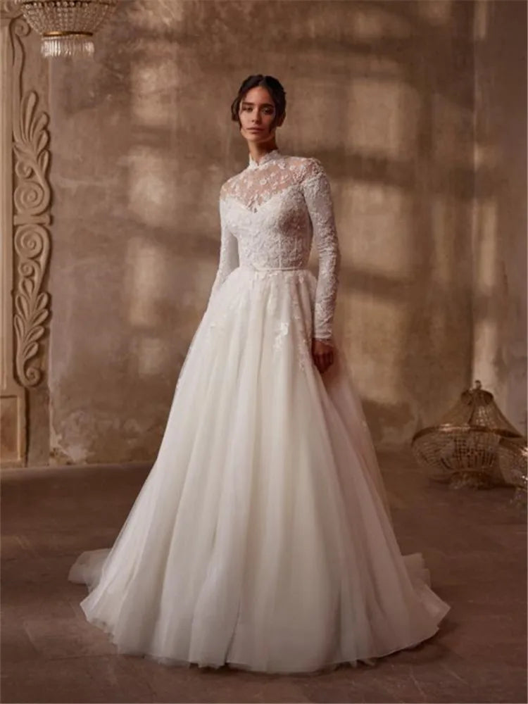 Indulge in timeless elegance with the Robe Mercer. This luxurious vintage wedding dress features intricate lace detailing, a stunning ball gown silhouette, and long sleeves for a touch of grace and sophistication. Perfect for the bride seeking a romantic and classic look on her special day.