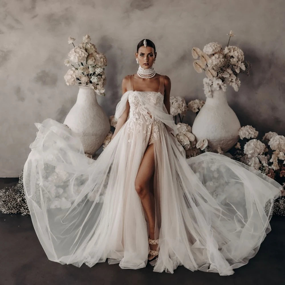 Elevate your wedding day with the Robe Satine, designed with seduction in mind. The off shoulder, high split design is delicately adorned with tulle appliques, shirred sleeves, and intricate beading lace. Its silhouette is perfect for maternity photoshoots and will make you feel like a goddess on your special day.