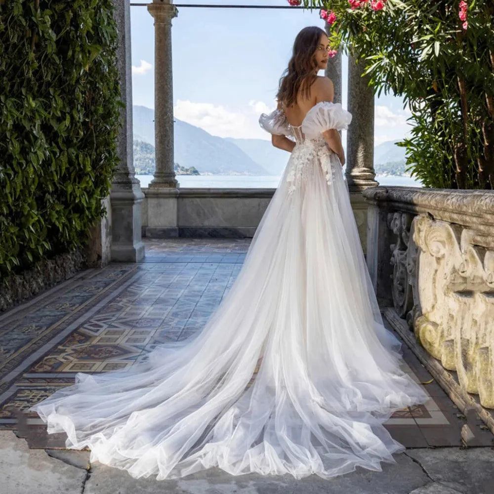 This luxurious Robe Remie wedding dress is crafted with sweetheart neckline, short puffy sleeves, beauteous lace appliques, zipper back, and court train. Feel stunning on your special day in this timeless beauty that will be sure to turn heads.