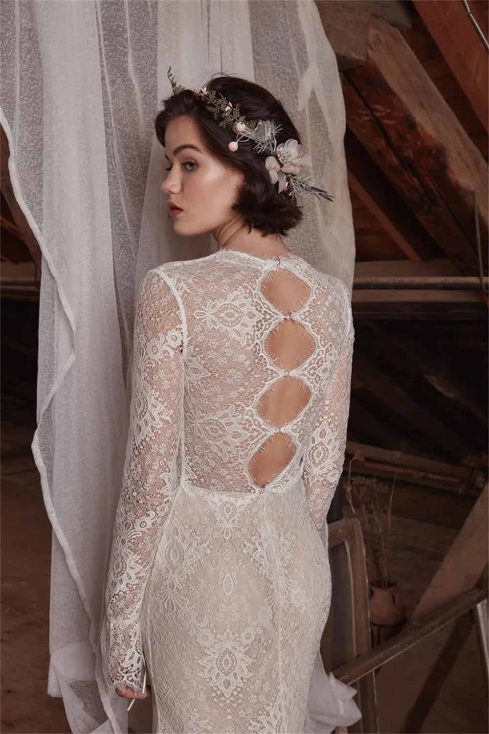 The Aveline wedding dress is perfect for looking beautiful and confident on your special day. The sexy mermaid cut and deep V neckline give you an elegant silhouette while the lace detail and long sleeves add a romantic touch. Create your dream bridal look with this stunning gown.