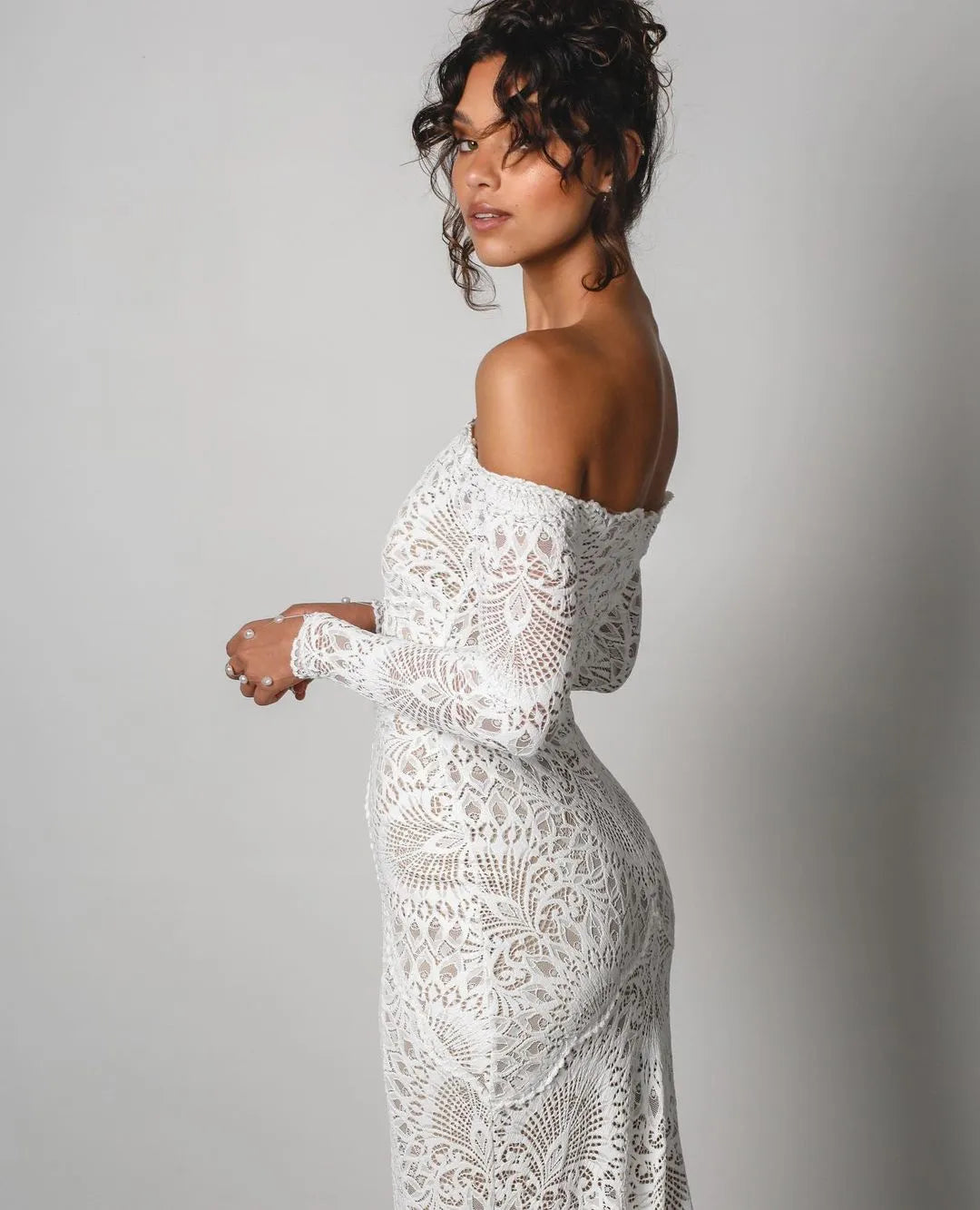 The Nathalia Gown exudes European charm with delicate textures and refined elegance. Its intricate trims and panelling evoke a romantic garden ambience, perfect for any special occasion. Embrace its timeless beauty and feel like a true fashion icon.