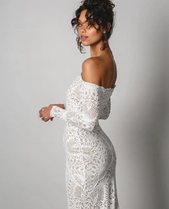 The Nathalia Gown exudes European charm with delicate textures and refined elegance. Its intricate trims and panelling evoke a romantic garden ambience, perfect for any special occasion. Embrace its timeless beauty and feel like a true fashion icon.