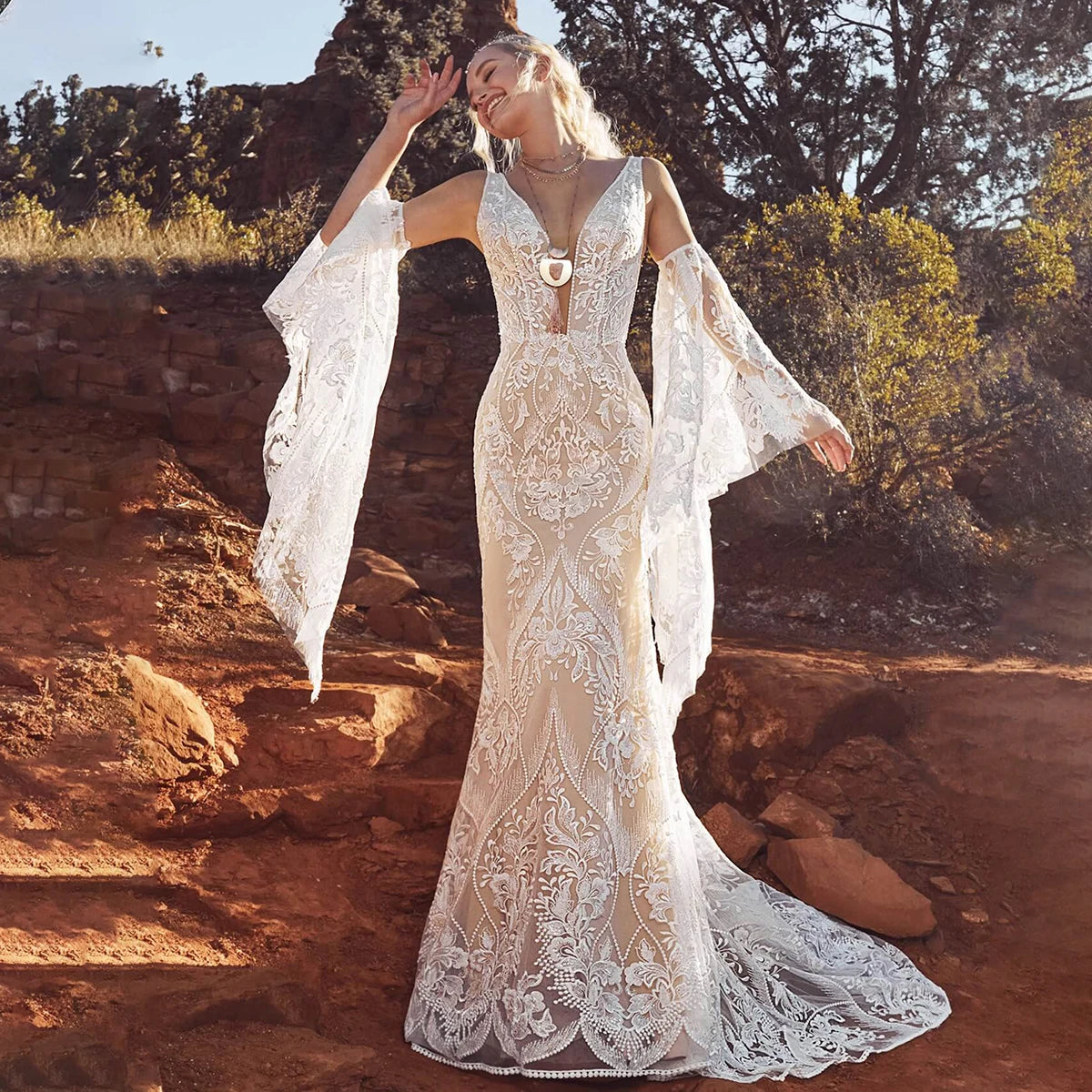 Unleash your inner mermaid with Dress Marina! Its long elastic batwing sleeves and elegant mermaid silhouette make it the ideal lace wedding dress for beachside nuptials. And let's not overlook the dazzling sequin accents - you'll radiate like the night sky in this captivating gown.