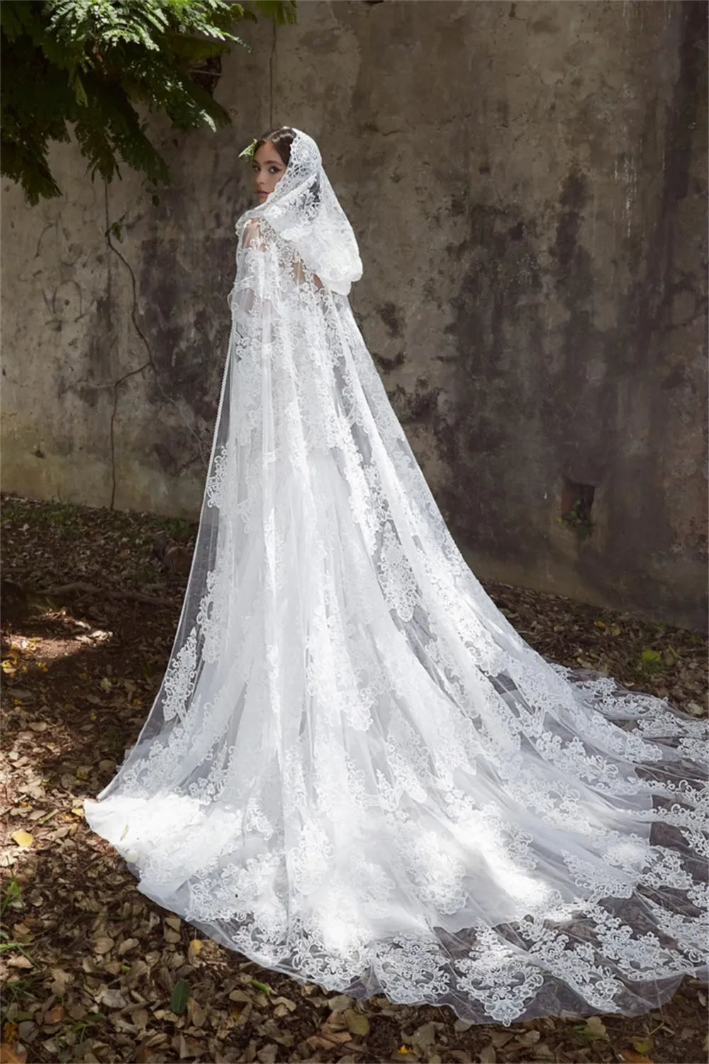 Experience true luxury with the Sabine Robe. This eye-catching floor-length gown features a beautiful mermaid silhouette with a sexy bateau neckline, a daring cut-out open back, and glimmering lace appliqués. Slay the aisle in this statement-making ensemble fit for royalty!