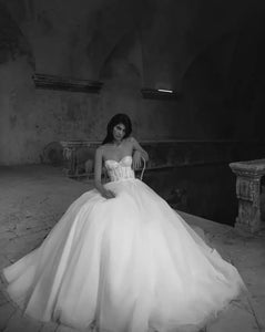 Unleash your playful and elegant side with Robe Eva! This A-line bridal gown features stunning appliques, perfect for your big day. Make a statement with this tres elegante robe, designed for the fashion-forward bride. Say oui to style!