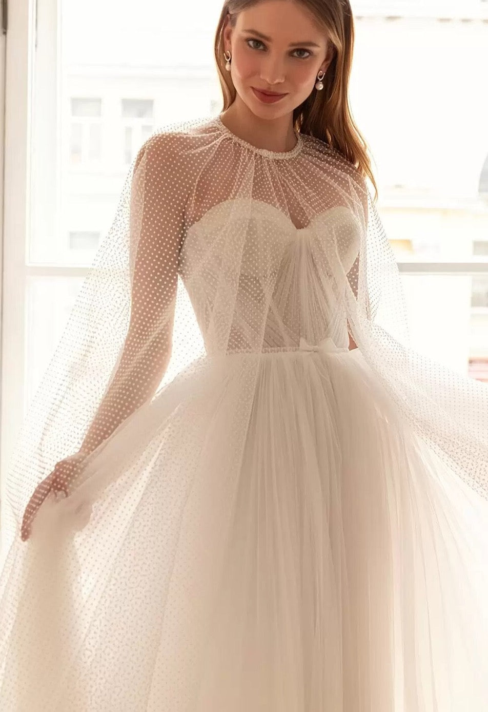 Our Dress Celine combines a sweetheart neckline and A-line silhouette for a flattering and classic bridal look. The two-piece design adds a modern twist, providing versatility for different wedding styles. Perfect for brides who want a timeless yet unique wedding dress.