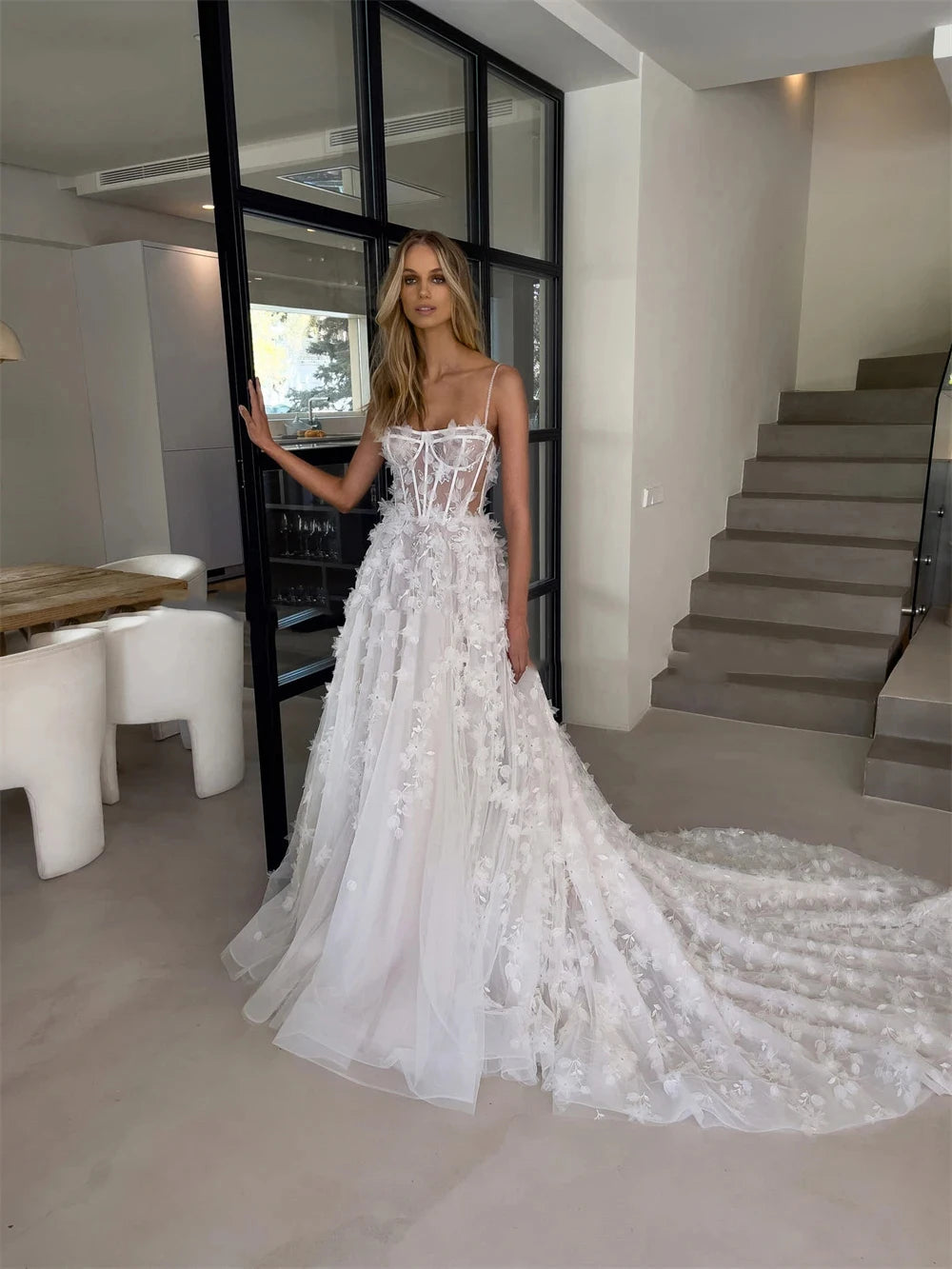 Indulge in pure elegance with Dress Anje. This off-shoulder wedding dress features a mermaid silhouette and a sweeping train, creating a majestic and sophisticated look. The sleeveless design adds a touch of modernity, making it perfect for the fashion-forward bride. Every detail is thoughtfully designed for a truly stunning statement on your special day.