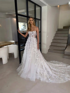 Indulge in pure elegance with Dress Anje. This off-shoulder wedding dress features a mermaid silhouette and a sweeping train, creating a majestic and sophisticated look. The sleeveless design adds a touch of modernity, making it perfect for the fashion-forward bride. Every detail is thoughtfully designed for a truly stunning statement on your special day.
