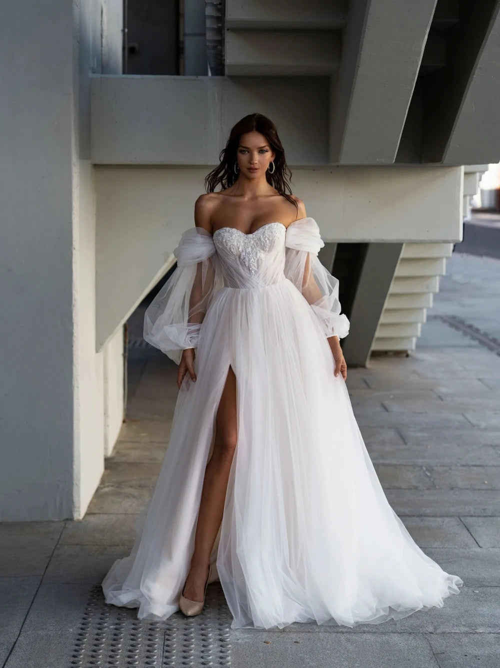 Indulge in pure luxury with our Robe Lova. This elegant off the shoulder wedding dress features sparkling sequins and beads, perfect for the modern bride. Its A-line silhouette flatters all body types, while the pristine white color adds an air of sophistication. Make a statement on your special day with this exclusive piece.